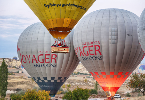 Voyager Balloons exploring remote Cappadocia valleys with dramatic canyon views