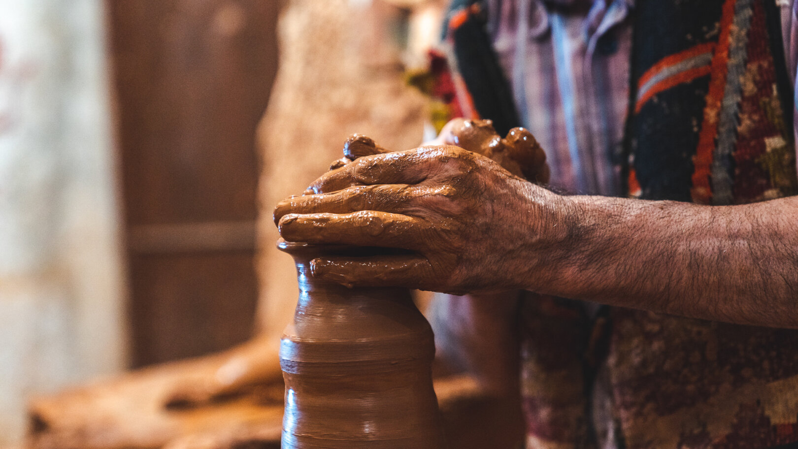 Master artisan presenting ceramic pieces in Avanos Cappadocia